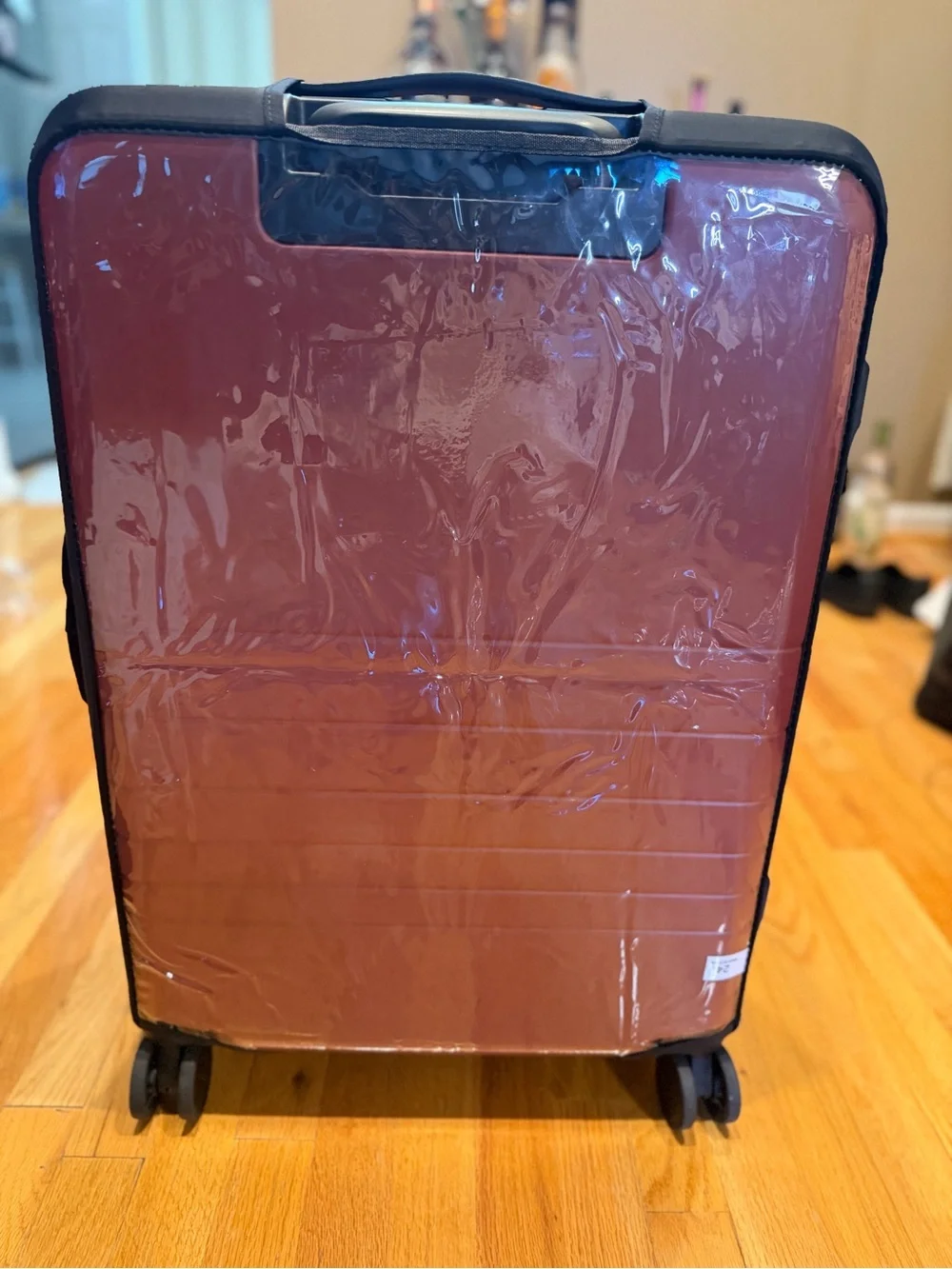 Monos medium check in 24” terracotta color suitcase LIKE NEW